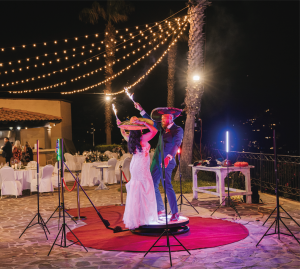 sparkler wedding dance under string lights at night during outdoor wedding reception