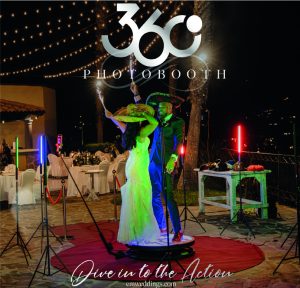 Sparkler exit wedding celebration at night outdoor EMweddings photobooth with bride and groom dancing.